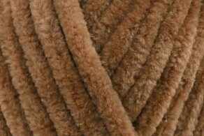 Close-up of thick brown boucle yarn strands showing a soft, textured fiber.