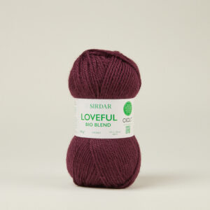 F265-0112 Enriched redbTwo burgundy skeins of yarn stacked vertically with a white label reading 'SIRDAR LOVEFUL BIO BLEND' between them.