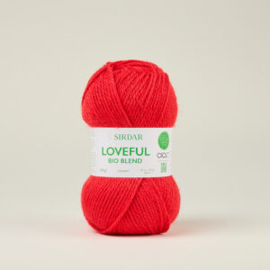 F265-0117 Radiant Red Bright red skein of yarn standing upright with a white label showing 'LOVEFUL BIO BLEND' on a neutral background.