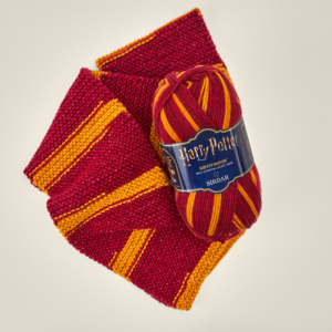 F934-0301 Sirdar Harry Potter Self-Striping Scarf Yarn - Ball and Scarf - Gryffindor 1