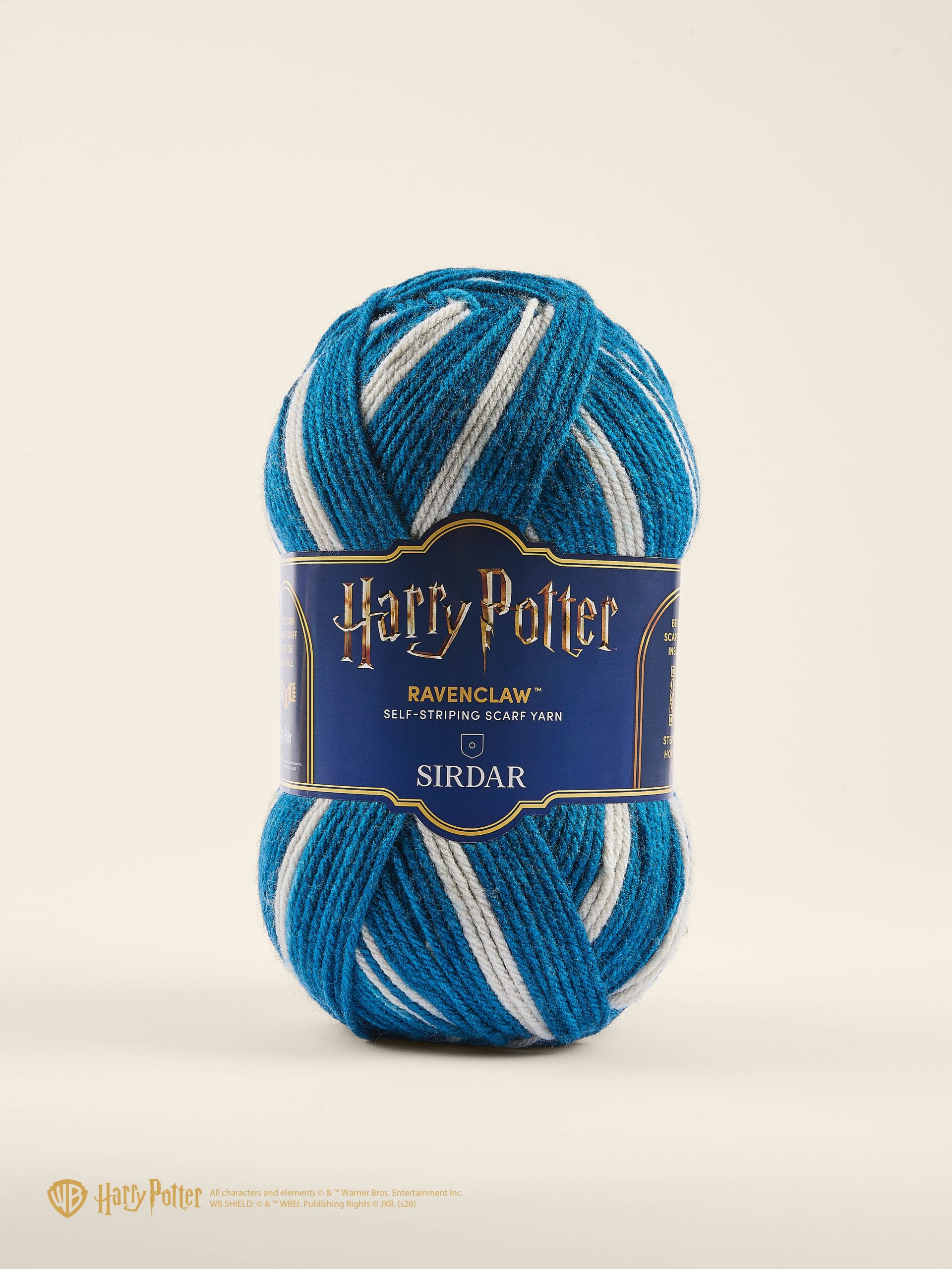 Blue and white striped Ravenclaw self-striping yarn skein with a Harry Potter label against a pale background, brand SIRDAR visible.